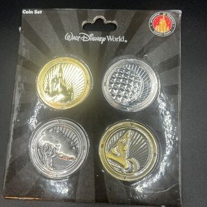 Walt Disney World exclusive Theme Park Icons 4 Coin Set..NEW in park packaging.
